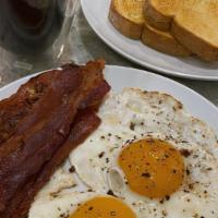 Breakfast # 2 / Desayuno  # 2 · 2 Huevos, Bacon, Salchicha, Tostado y Cafe /
2 Eggs, Bacon, Sausage, Toast and Coffee