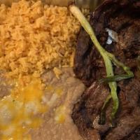 Carne Asada · Favorite six ounces a portion of seasoned skirt steak carefully charbroiled to perfection. G...
