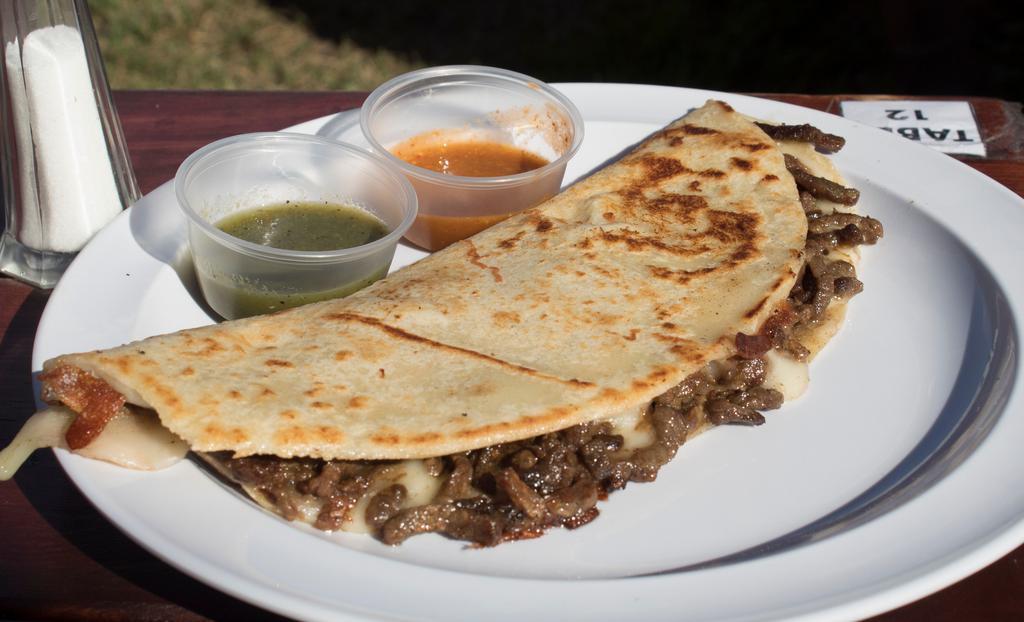 Quesadillas · Large corn or flour tortilla, with Mozzarella cheese and your choice of meat.