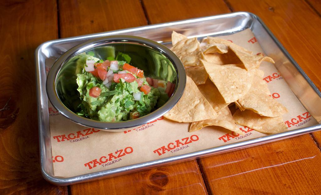 Guacamole · Mashed avocados, chopped onion, cilantro, tomatoes, and lime. Served with tortilla chips.