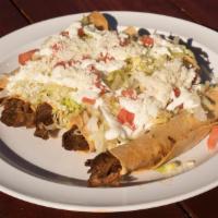 Flautas · Five deep-fried rolled tortillas filled with your choice of chicken or barbacoa.