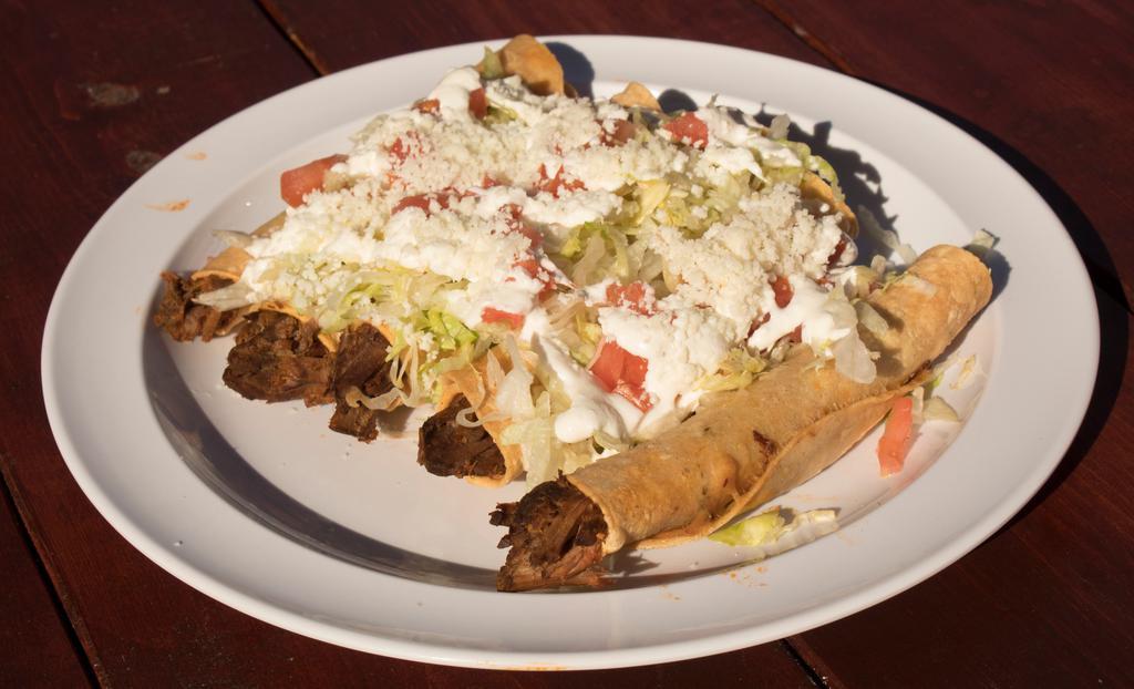 Flautas · Five deep-fried rolled tortillas filled with your choice of chicken or barbacoa.