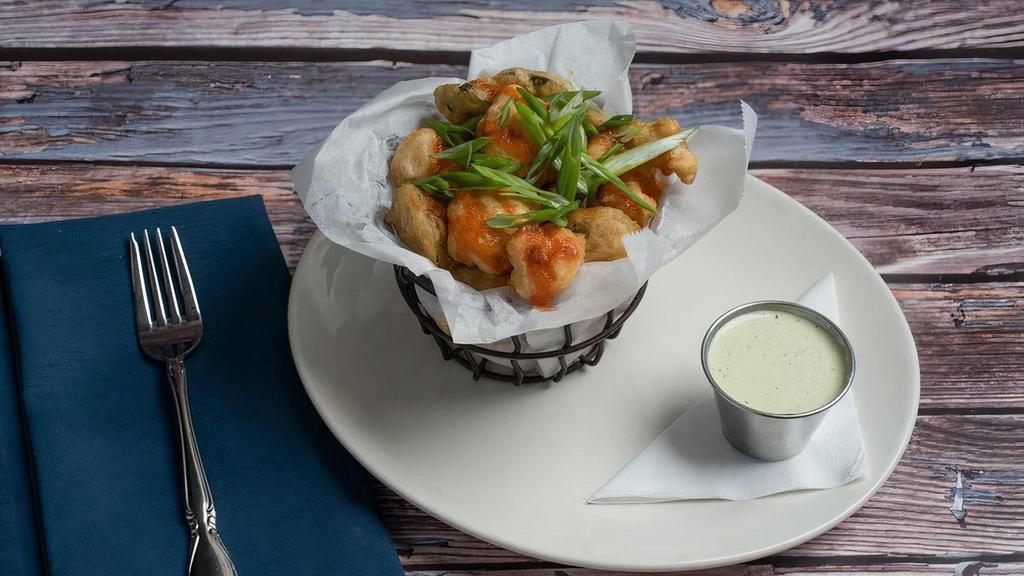 Spicy Cauliflower Bites* · beer-battered and lightly fried cauliflower florets & sliced jalapeños, green onions, sriracha honey drizzle, green tomato aioli dipping sauce