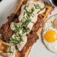Country Style Fried Chicken* & Waffles · honey dusted fried chicken over buttermilk waffles, topped. with milk gravy & basil, with tw...