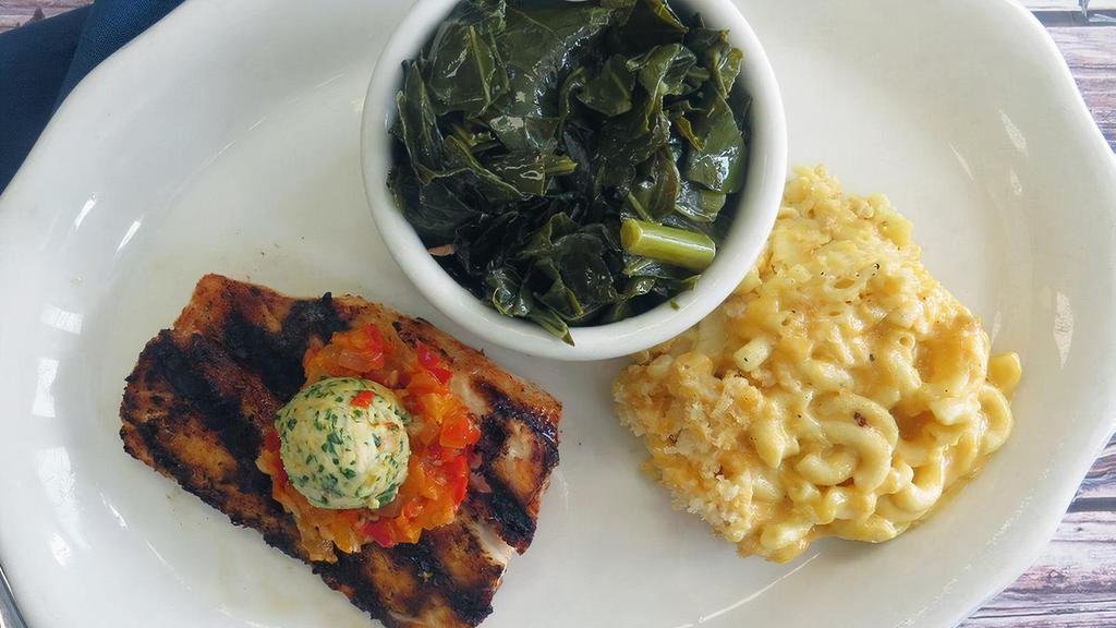 Blackened Mahi-Mahi · grilled to perfection served with creole butter. and choice of two farm fresh sides