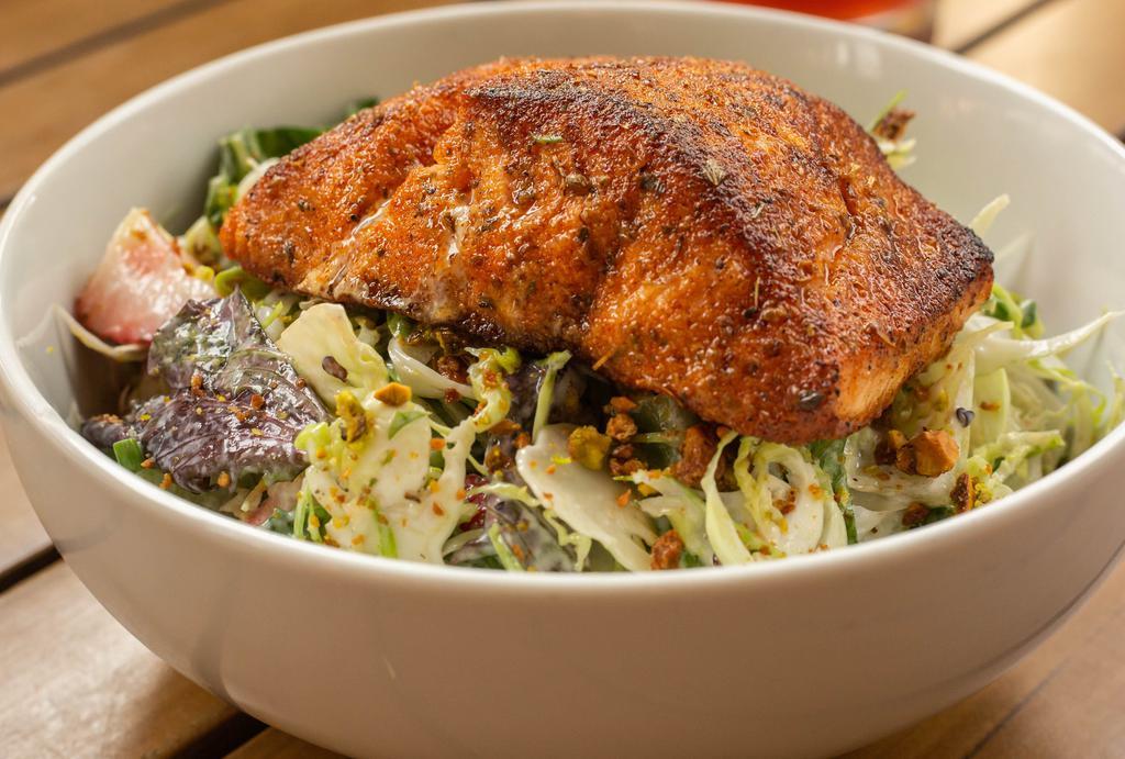 Blackened Salmon Salad · shaved fennel and brussels sprouts, baby gem, kale, strawberries, avocado, goat cheese, candied pistachio, honey vinaigrette