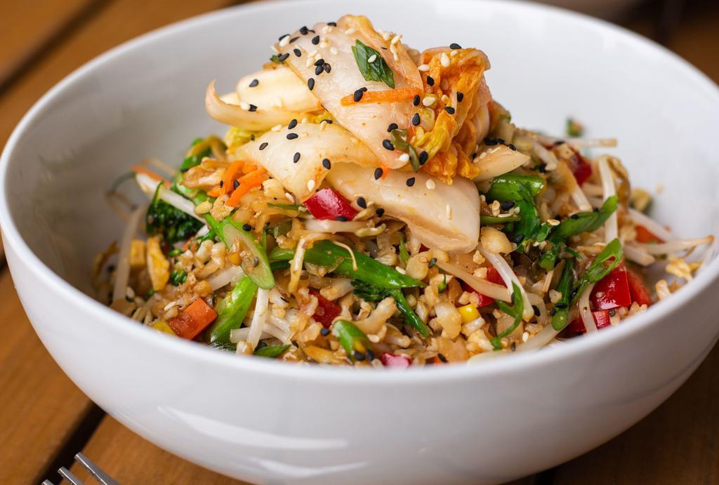 Vegan Fried Rice Bowl · cauliflower rice, peppers, kimchi, corn, bean sprouts,. carrots, broccolini, soy