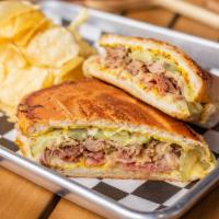 El Cubano · tavern ham, braised pork, house mustard, pickles