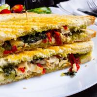 Pesto Chicken Sandwich · Marinated Grilled Chicken, fresh Italian basil, sun-dried tomato, goat cheese and cashew pes...