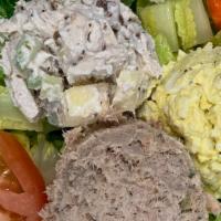 Trio Salad · Romaine lettuce, chicken, tuna & egg salad, tomatoes, & carrot sticks.

Our chicken salad co...