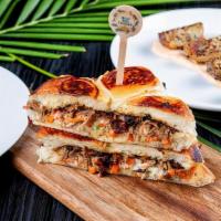 Original Pulled Oxtail Sandwich (Whole Portion) · Mouthwatering braised and pulled oxtail meat, resting upon luxurious seasoned slaw. Sandwich...