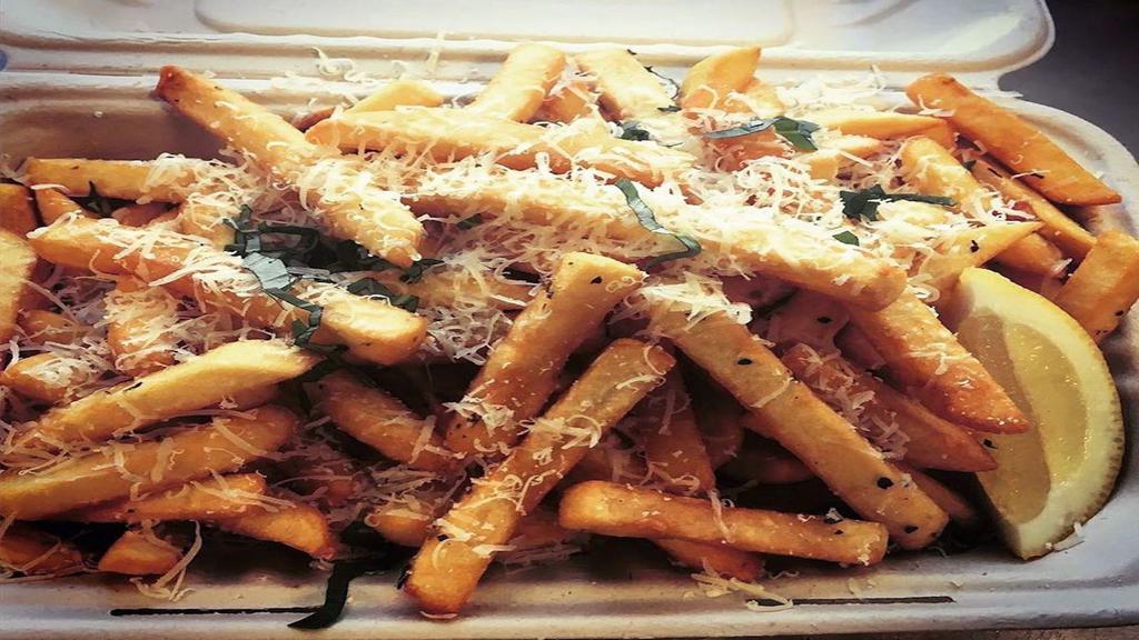 Truffle Fries · Fries topped with truffle oil, freshly shaved parmesan, dried Italian herbs with garlic aioli dipping sauce.