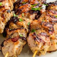Grilled Chicken Skewers  · Cubes of boneless white meat chicken  served with Rice
