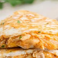 Chicken Quesadilla · A simple flour tortilla with grilled chicken topped off with a melted three-cheese blend, an...