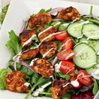 Chicken Tikka Salad · chicken tikka served on a bed of lettuce-tossed in a light chef special dressing and garnished