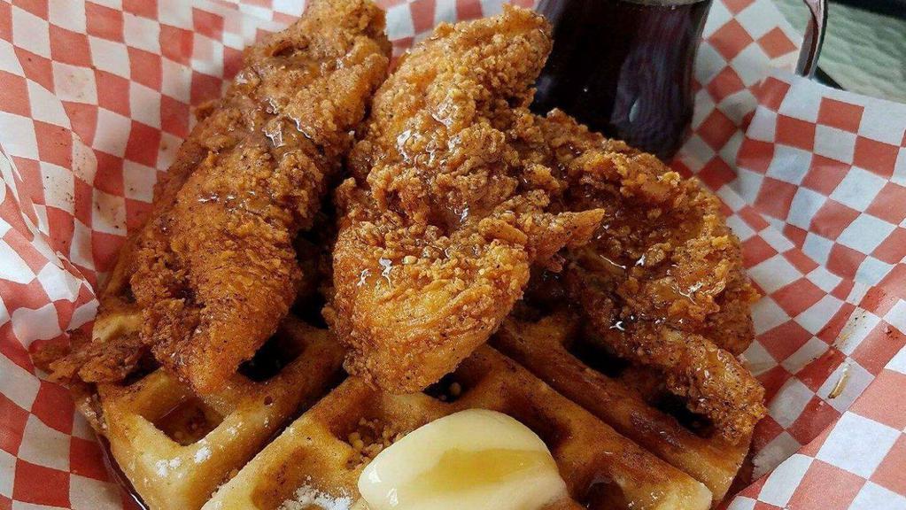 Hot Chicken & Waffles · Comes with a belgian waffle, three jumbo chicken tenders, syrup, and butter.