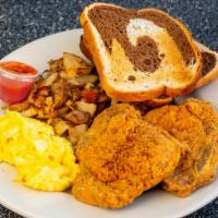 Pork Chops & Eggs · Two pork chops, grilled or fried with two eggs any style, grits and choice of toast or multi...