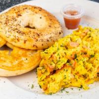Sassy Scramble · Eggs scrambled with onions, fresh herbs, smoked salmon and cream cheese. Served with toast o...