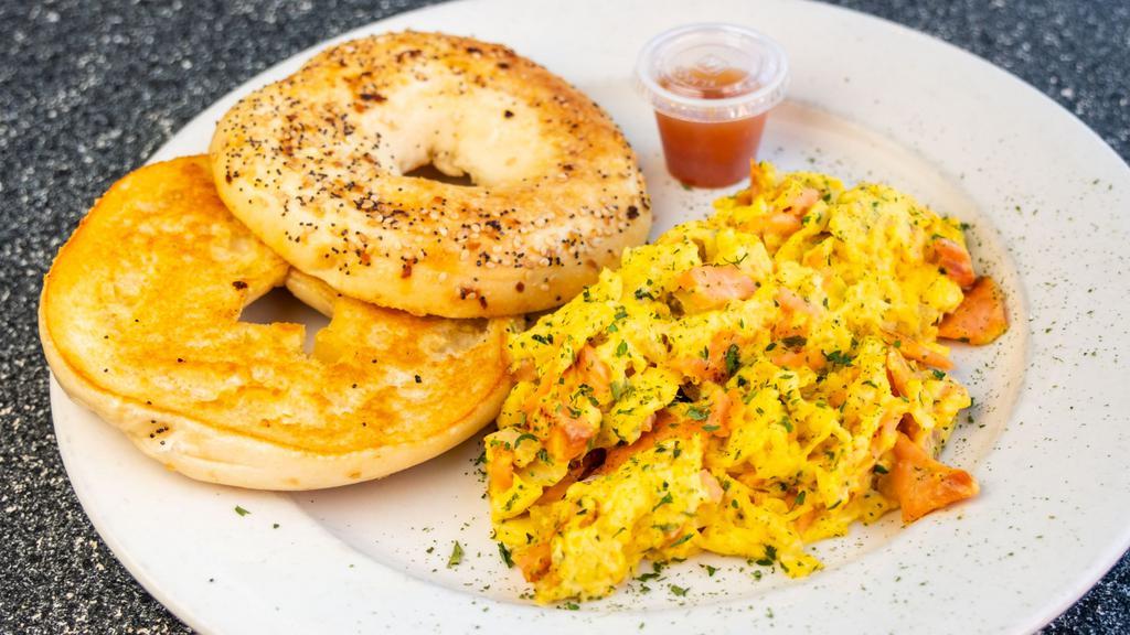 Sassy Scramble · Three eggs scrambled with onions, fresh herbs, lox and cream cheese. Served with a grilled bagel
