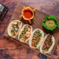Zama'S Selection Tacos · Selection of four tacos steak, chicken, shrimp, and brisket. Served with avocado slices, raw...