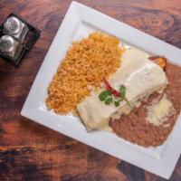 Zama Grill Burrito · Our mouthwatering grilled steak or chicken rolled in a flour tortilla and covered with our t...