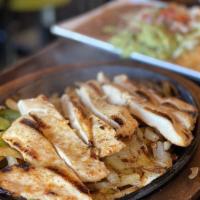 Chicken Fajitas · Fajitas grilled chicken (marinated in our own zama's recipe) sizzling hot, on a bed of bell ...
