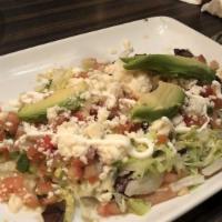 Authentic Mexican Huarache · Choice of steak, chicken, or shrimp on an original, freshly made long thick corn tortilla to...