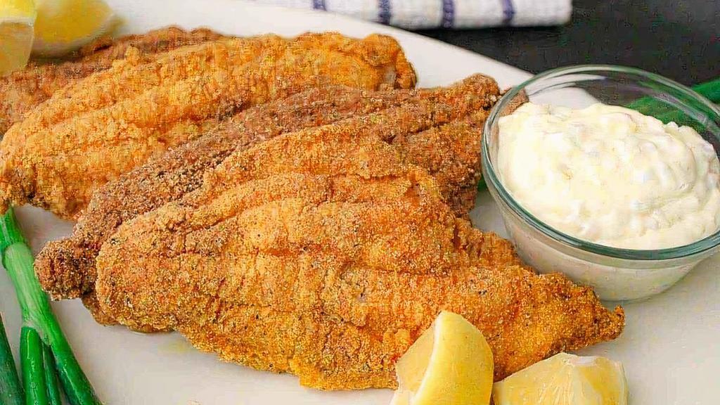 1 Piece Catfish Snack · One fried catfish fillet that comes with your choice of side and one honey cornbread muffin.