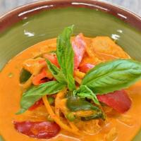 Red Curry · Spicy. Red curry + coconut milk with bamboo shoots, bell pepper, basil leaves & sweet peas.