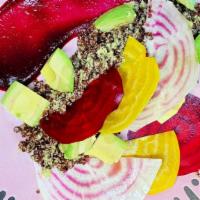 Beet-Ween The Lines · green goddess dressing, red quinoa, candy striped beet, red and yellow beets, and avocado.