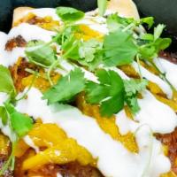 Choriz-No Enchilada · Impossible chorizo, flour tortilla,rice, pinto beans, vegan cheese, salsa roja, vegan crema,...
