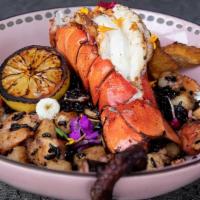 Forbidden Sea · black Indian rice, sofrito, lobster, shrimp, scallops, octopus, and maduros.
