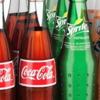 Mexican Soda · Choose One: Bottled Coke, Sprite, or Fanta Piña.