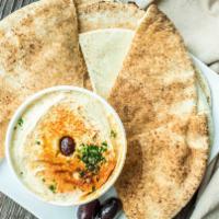 Hummus · Healthy dip made from blend of chick peas, tahini, lemon juice, and garlic. Prepared with ex...