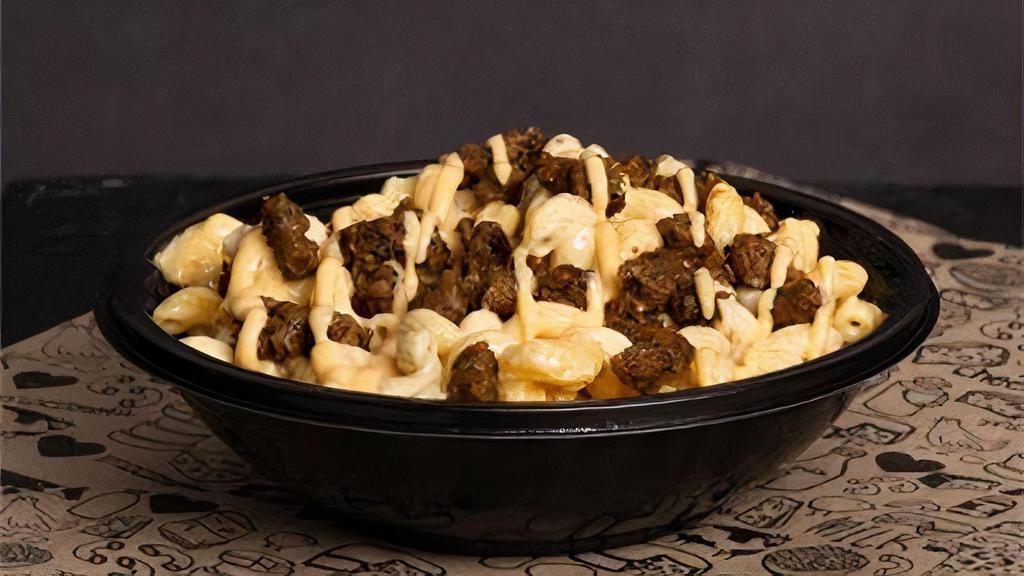 Vegan Bowl With Beyond Beef · Build your own Vegan Bowl with your choice of Pasta, Broccoli, Cauliflower, Tater Tots or Quinoa as your base with our Vegan Cheese Sauce plus your choice of Beyond Beef Proteins, Vegan Cheeses, & Vegetables.