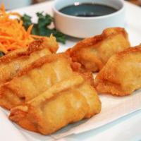 Gyoza · Deep fried or steamed seasoned pork in a thin pastry.