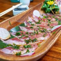 Tuna Tataki · Lightly seared tuna tataki served with ponzu sauce, scallions and sesame seeds.