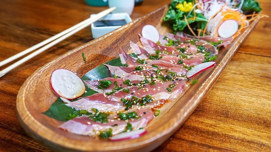 Tuna Tataki · Lightly seared tuna tataki served with ponzu sauce, scallions and sesame seeds.