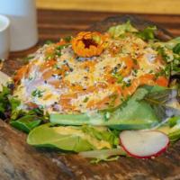Rene'S Salad · A mix of organic greens, salmon, imitation krab, avocado, sesame seeds with our homemade spe...
