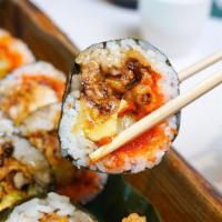 Spider Roll · Soft shell krab lightly fried with asparagus, avocado, masago and sesame seeds, seaweed on t...