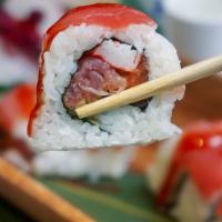 Margarett Roll · Krabstick, avocado, salmon, tuna, white fish and topped with spicy tuna.