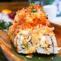 Volcano Roll · Krab, avocado, cream cheese, masago and sesame seeds topped with our baked seafood secret, s...