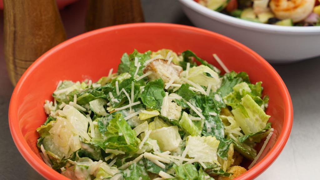 Caesar Salad · Crispy romaine lettuce tossed with parmesan cheese, seasoned croutons and Caesar dressing.