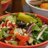 Greek Salad · Crisp romaine lettuce, tomatoes, roasted red peppers, feta cheese, kalmata olives, cucumbers...