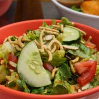 Asian Sesame Salad · Crisp romaine lettuce, mandarin oranges, sliced almonds, crispy noodles, cucumbers, tomatoes...
