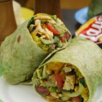Buffalo Chicken Caesar Wrap · Romaine lettuce, tomatoes, parmesan cheese, croutons, Caesar dressing and buffalo sauce on a...