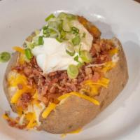 Fully Loaded Baked Potato · Loaded with butter, cheese, bacon, chives and sour cream.