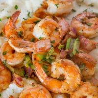 Shrimp And Grits · Includes grilled shrimp on a bed of cheese grits.