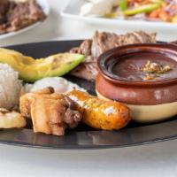 Bandeja Paisa (Colombia) · Traditional colombian platter of griddle steak, crispy pork belly, caramelized plantains, re...