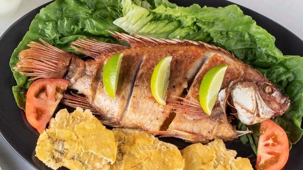 Mojarra Cartagenera (Colombia) · Whole crispy deep fried tender “mojarra” fish (center bone) served with Home made ¨Titote¨coconut rice and crispy patacon.